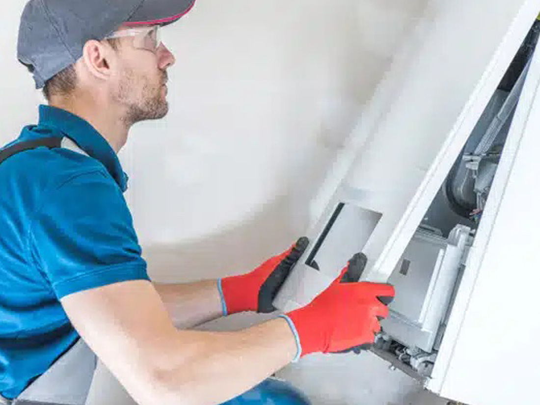 technician working on a furnace